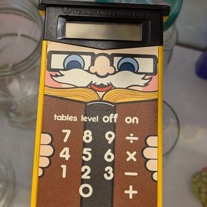 Texas Instruments Yellow Novelty Calculator with Brown Illustrated Front